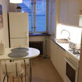 Fully equipped kitchen with fridge, freezer and stove,.