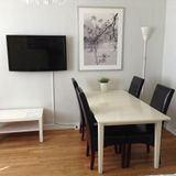 Dining area and TV, 1,5-bdr serviced apartment.